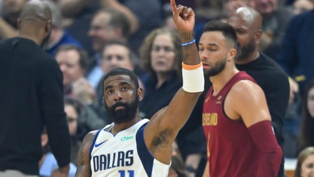 Feb 27, 2024; Cleveland, Ohio, USA; Dallas Mavericks guard Kyrie Irving (11) reacts to fans in the first quarter against the Cleveland Cavaliers at Rocket Mortgage FieldHouse.